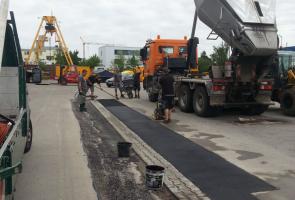 Asphaltbirne Lastwägen München